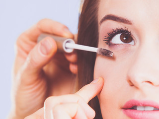 Woman getting make up done by artist