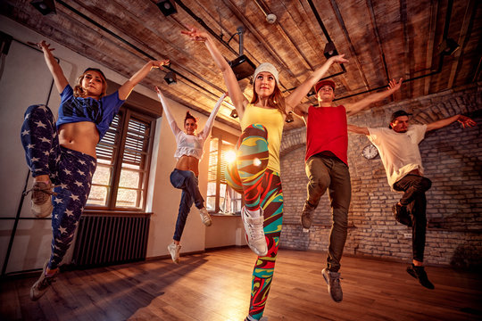 modern dancing group practice dancing in jump. Sport, dancing and urban culture concept