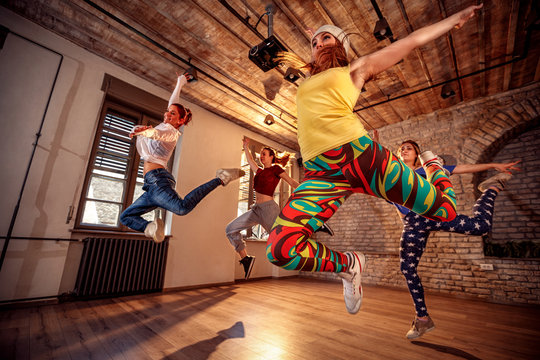 Group of modern dancer jumping during music