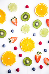Sliced fruits on white background