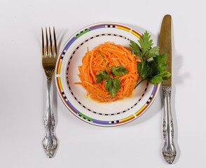Carrots and finely chopped parsley on the plate.
