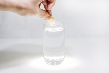 Vitamin C in glass with water. Abstract photo of healthy.