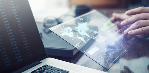 Man with futuristic digital tablet