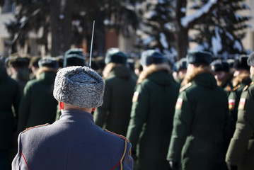 Russian Winter. A soldier with a bayonet in a karakul cap