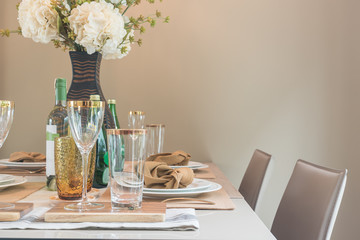 table set on dining table in modern dining room