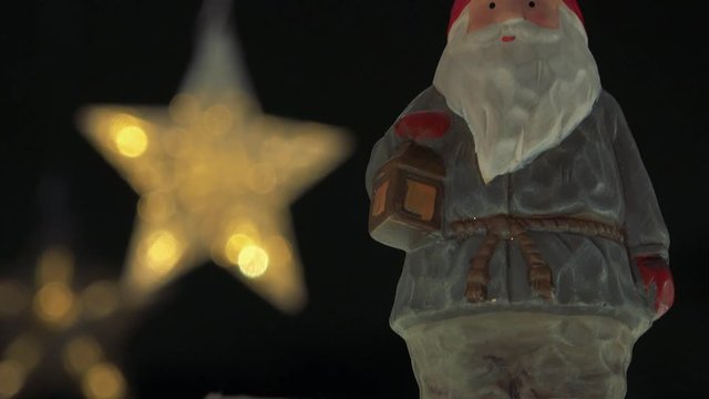 Closeup on a statuette of Ded Moroz on a cardboard box