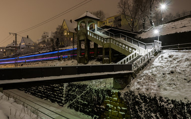 Light trail of a train at night in winter