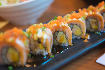 Sushi roll is served on plate