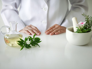 the scientist,dermatologist testing the organic natural  cosmetic product in the laboratory.research and development beauty skincare concept.blank package,bottle,container .cream,serum.hand