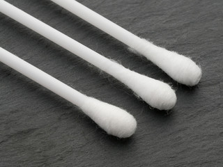 Cotton buds on stone surface Macro shot.