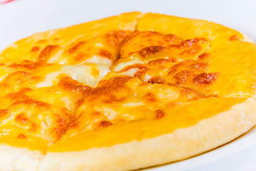 Georgian khachapuri with cheese on white plate