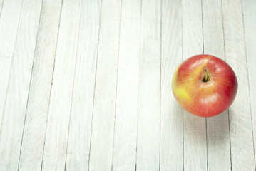 apples on white wooden table