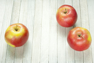 apples on white wooden table