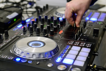 Fototapeta na wymiar DJ mixes music at a party. Musical Equipment sound for professional DJs.