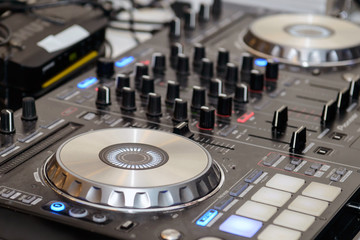 DJ music mixer at the party. Audio equipment for professional DJs. 