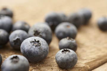 close up of blueberry on vintage, wooden table