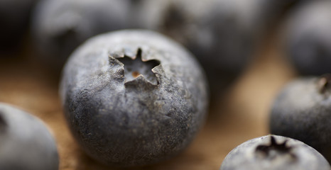 close up of blueberry on vintage, wooden table