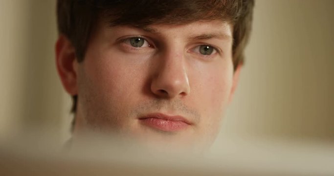 4k, Closeup of a businessman engrossed in his work and looking at the laptop.