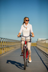 Fototapeta premium Woman riding bike outdoor