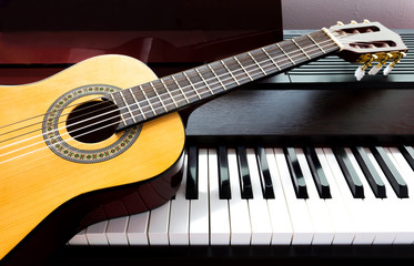 Fototapeta na wymiar Guitar and piano. Music instrument. Art and music background.