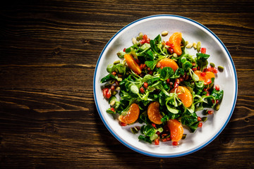 Vegetable salad on wooden background
