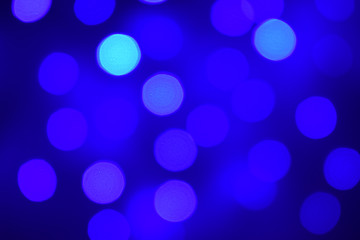 Blue illuminated background with different blurred tones, bokeh lights