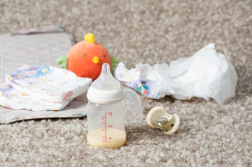 Baby bottle and disposable diapers