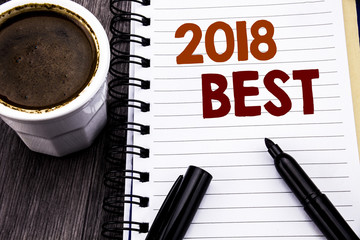 Writing text showing 2018 Best. Business concept for Choice Review written on notebook book note paper on the wooden wood background. With coffee and black marker.