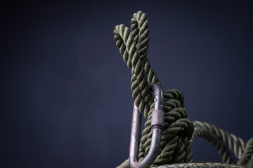 Coiled climbing rope with carabiner