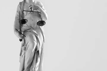 statue of justice with sword and scales, legal law concept (black and white effect)