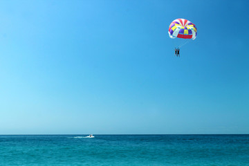 Fototapeta na wymiar Paraglider over the sea