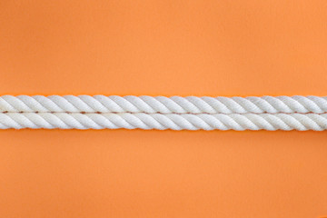 White ropes on orange