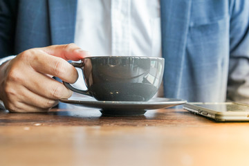 close up business man with coffee cup.