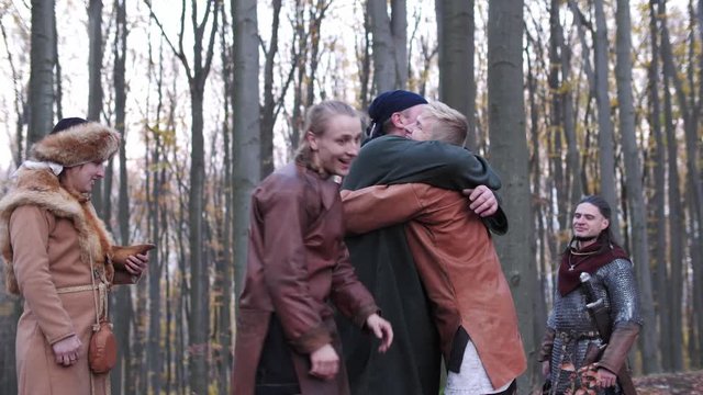 Vikings have some fun. Vikings hugs with each other and smiling