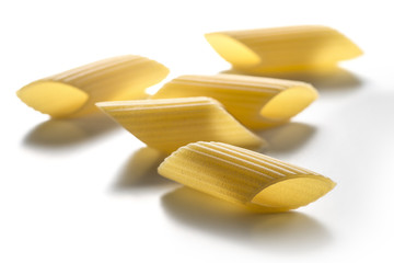 Some pieces of big pasta isolated on white background