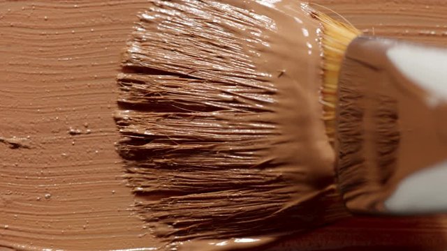 liquid foundation texture smudge with brush. Makeup base closeup texture