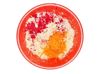 Freshly sliced vegetables carrots beets cabbage, grater