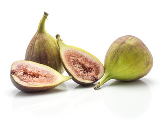 Two figs two sliced halves rose flesh isolated on white background ripe fresh purple green.