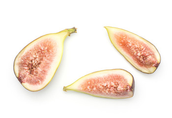 Cut figs top view isolated on white background one half two slices ripe purple green rose flesh.