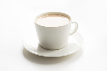 White cup of coffee with milk on white. Breakfast concept.