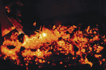 Fototapeta na wymiar Close up of burning firewood in the fireplace
