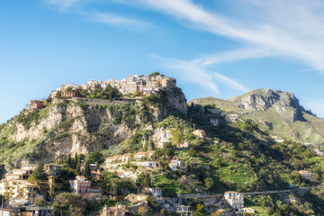 Fototapeta na wymiar Small town Castelmola on the top of the mountain. Taormina. Province of Messina. Sicily, Italy.
