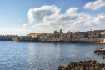 Fototapeta premium The coastline of ancient Ortygia island, Syracuse, Sicily, Italy.