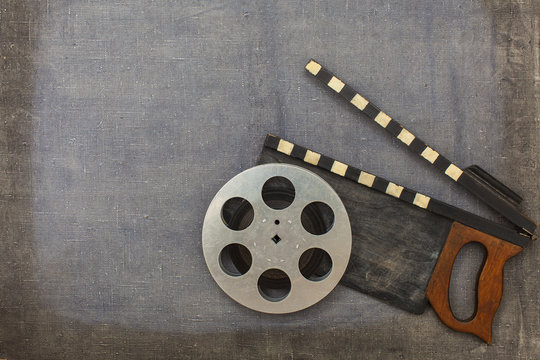 Movie clapper and film reel