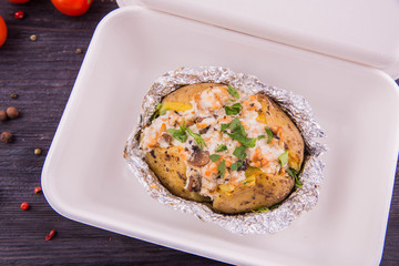 The stuffed potatoes vegetables and mushrooms with greens
