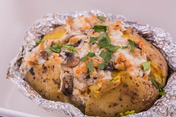 The baked stuffed potatoes with mushrooms and greens
