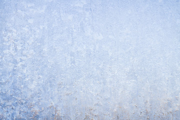 Winter frosty patterns on the frozen ice window