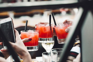 People have fun and drink cocktails.