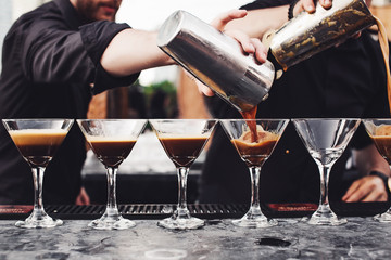 People have fun and drink cocktails.