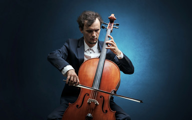 Cellist playing on instrument with empathy